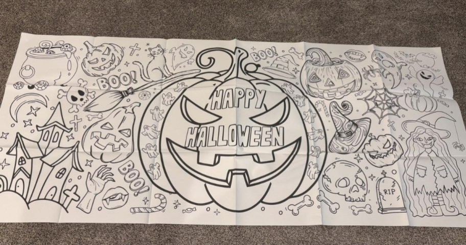 large halloween coloring tablecloth laid out on carpet