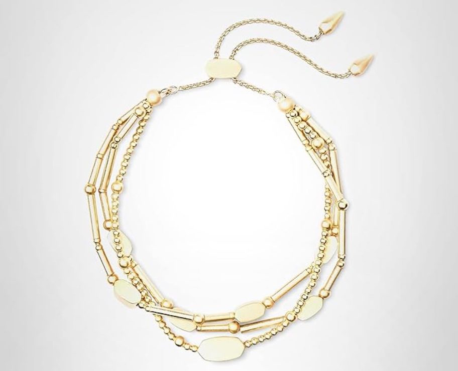 gold bracelet on gray background