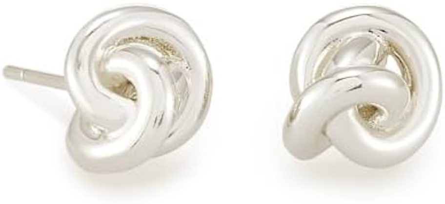 silver knotted earrings on white background