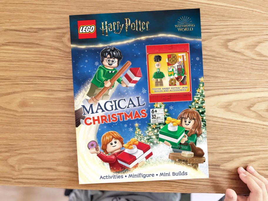 LEGO Harry Potter: Magical Christmas! Activity Book laying on a wood table