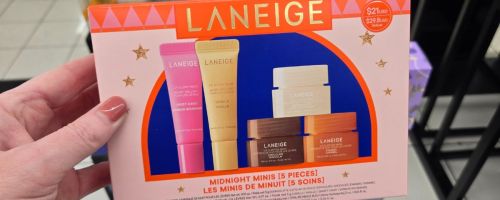 Hand olding a laneige midnight minis gift set