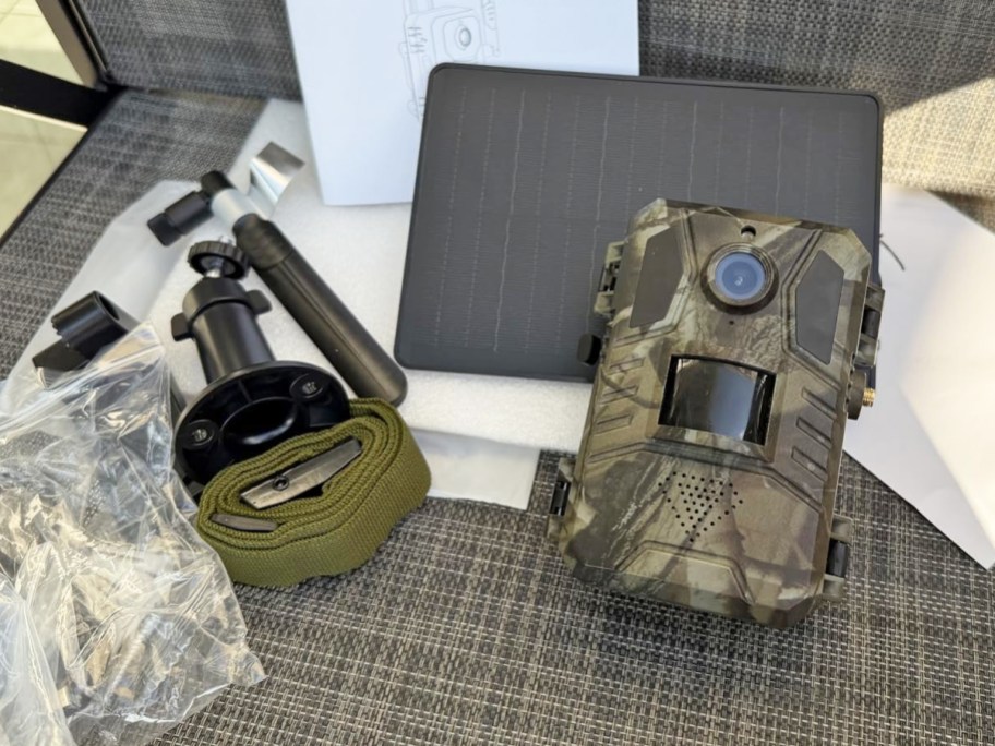 trail camera and accessories laid out