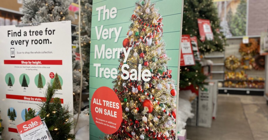 The very merry tree sale signage inside Michael store