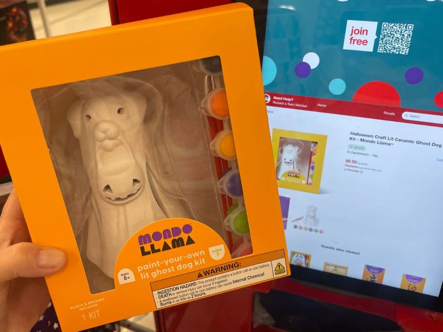 hand holding Mondo Llama Halloween Craft Lit Ceramic Ghost Dog Painting Kit