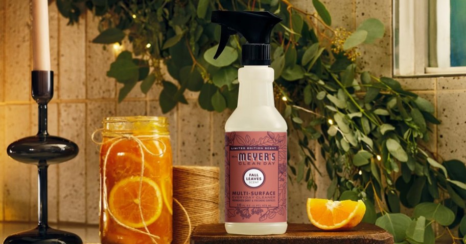 Mrs Meyers Cleaner Spray on counter near sliced oranges