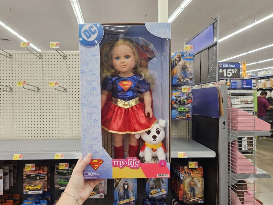 hand holding My Life As Super Girl 18" Doll box in store