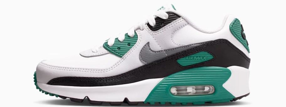 white, black, and green nike sneaker
