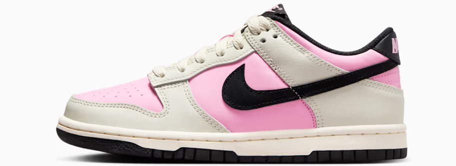 beige, pink, and black nike sneaker