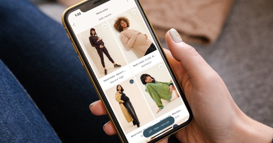 hand holding phone with nuuly maternity on screen