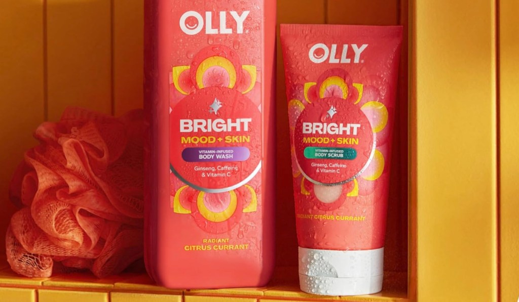 bottles of Olly Mood + Skin Body Scrub in yellow tiled shower