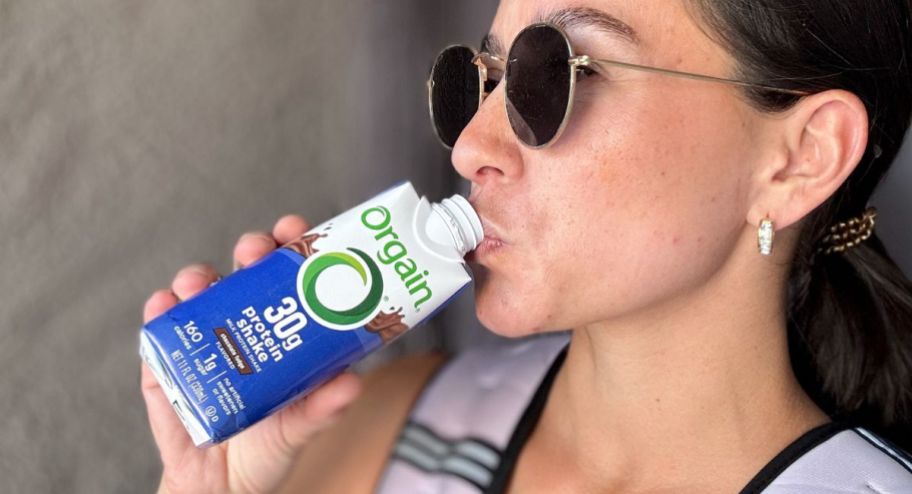 Woman drinking an orgain protein shake
