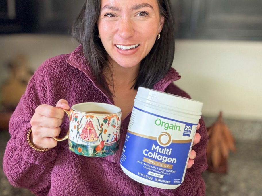 Woman holding a tub of Orgain Multi Collagen Peptides Powder and mug of coffee