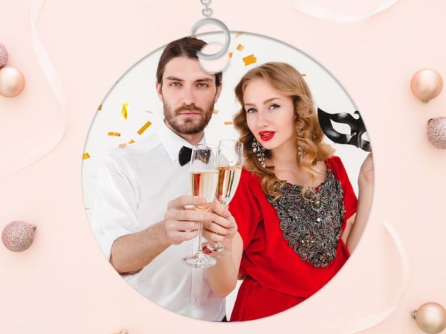 Photo ornment with couple in photo and pink background 