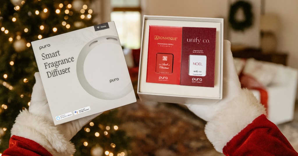 santa claus holding PURA Make it Merry Set