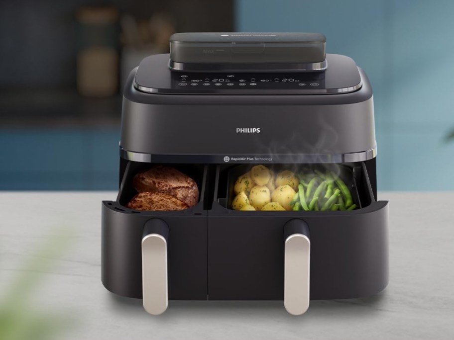 philips 5000 series dual basket air fryer on counter with drawers open