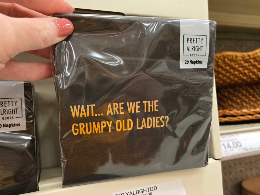 hand holding a pack of napkins that says 'Wait… Are We The Grumpy Old Ladies?'