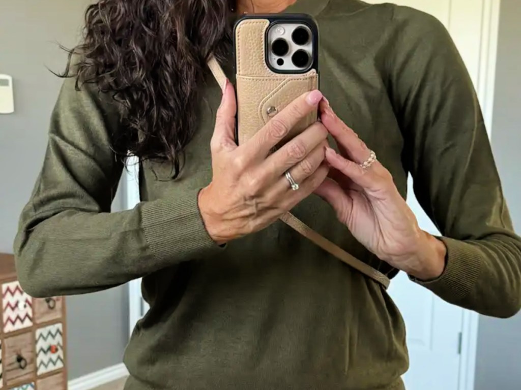 Woman wearing olive green, quince cashmere sweater