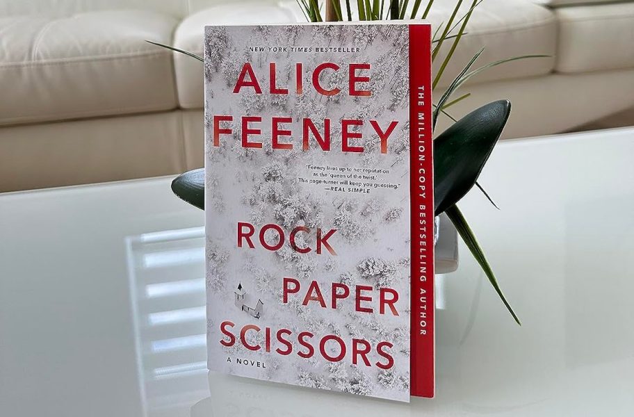 Rock Paper Scissors book on shiny white table