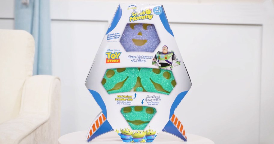 Scrub Mommy sponges in a rocket ship box on a table