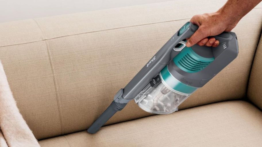 Hand holding Shark Pet Pro Cordless Stick Vacuum w PowerFins Brushroll 2