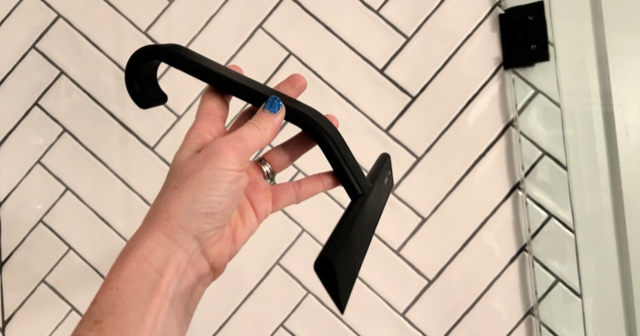 woman holding black Shower Squeegee