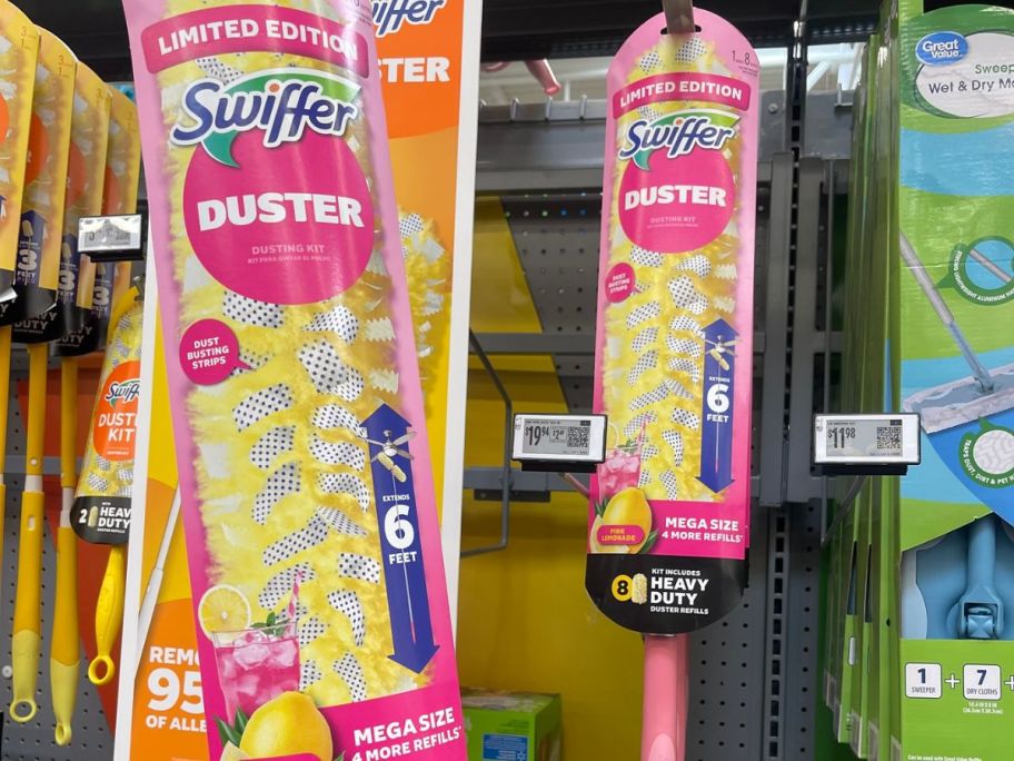 hand holding pink Swiffer duster on display at the store