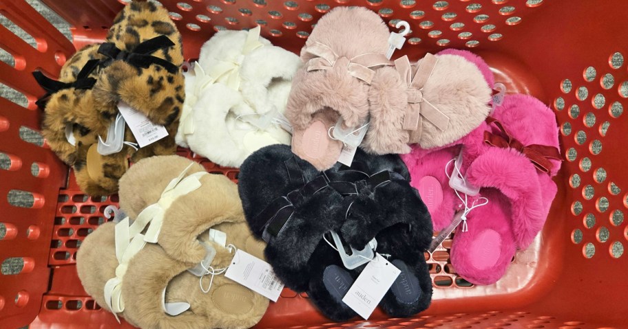 multiple pairs of bow slippers in a red shopping cart
