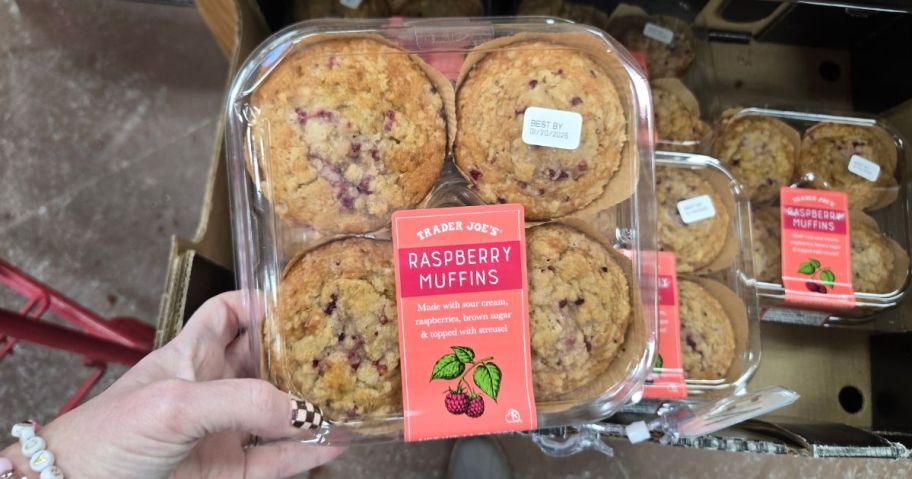 A person holding a box of cookies