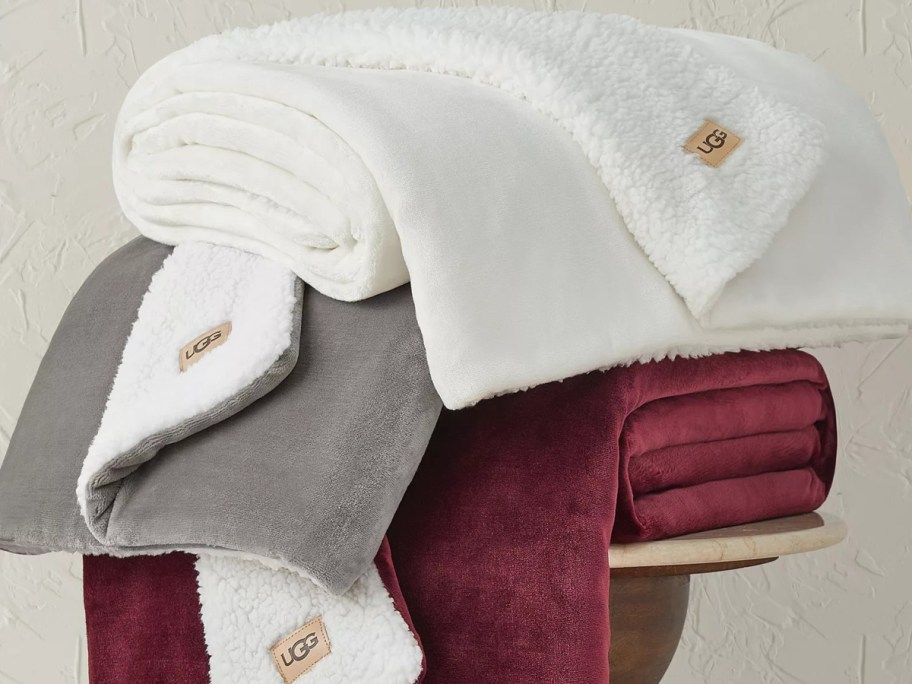 A pile of UGG throw blankets.