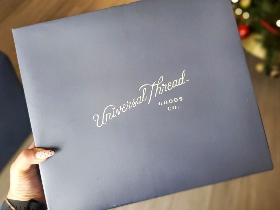 hand holding a universal thread box