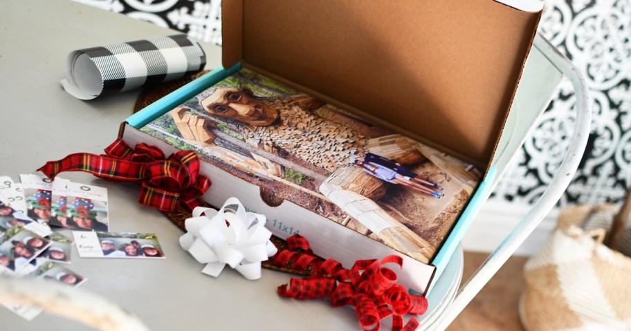 Photo canvas in a box near ribbons and wrapping supplies