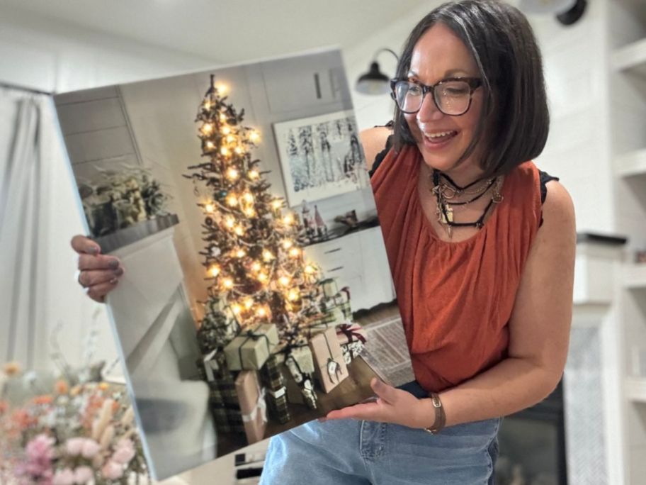 Woman holding a Walgreens 16x20 Canvas of an illuminated christmas Tree