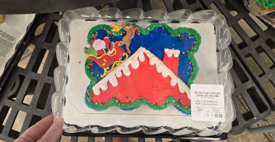 a Cupcake Cake with Santa on a house with his sleigh