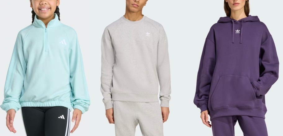 people wearing blue, gray, and purple sweatshirts 