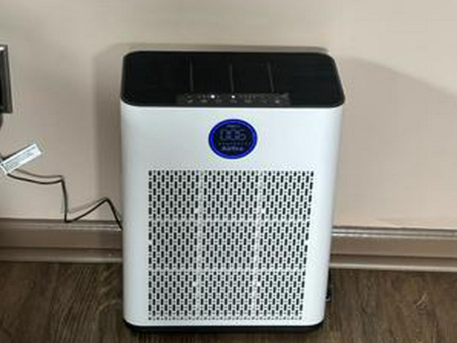 airefire purifier against a wall