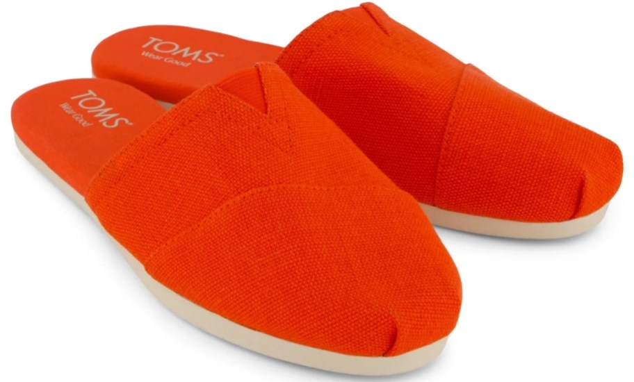 a pair of red closed toe slides