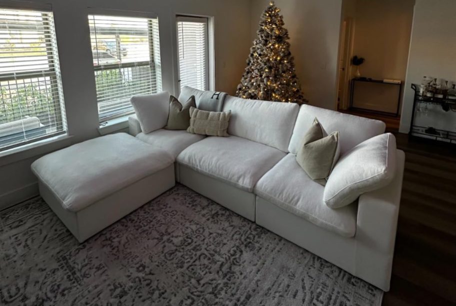 white cloud couch lookalike in living room with christmas tree