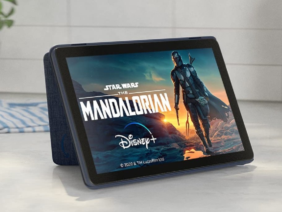 A propped up Amazon Kindle showing the Mandalorian.