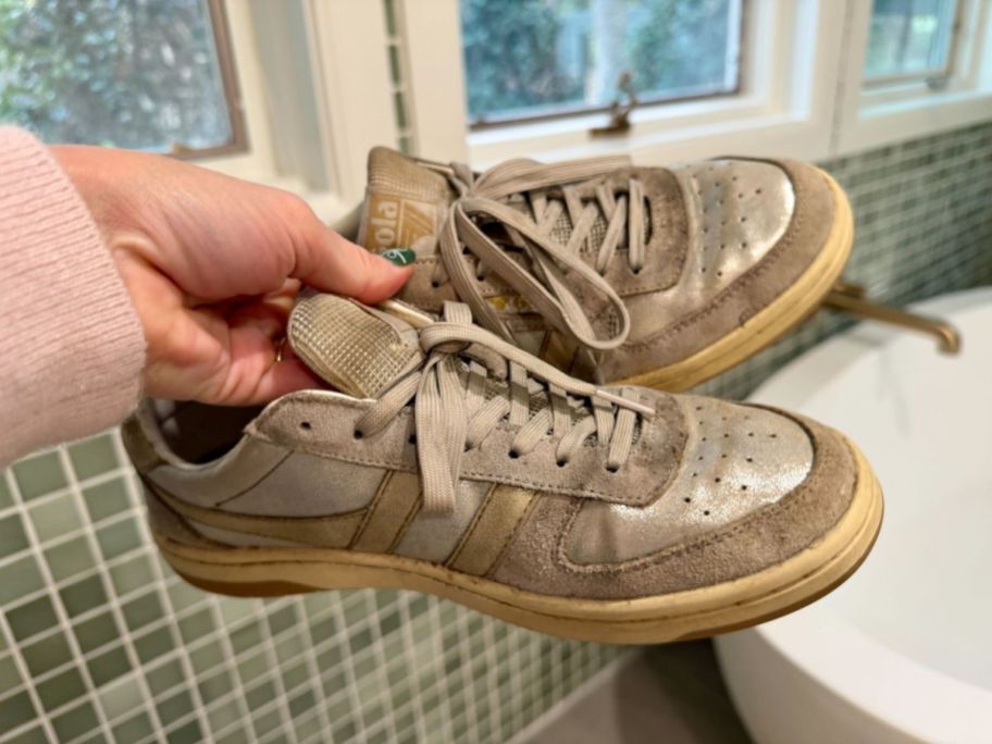 collin holding Gola Hawk Metallic Sneakers