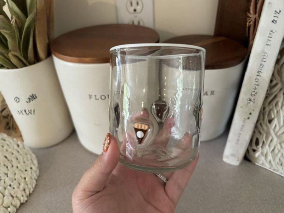 hand Anthropologie Icon Juice Glass in hand in kitchen