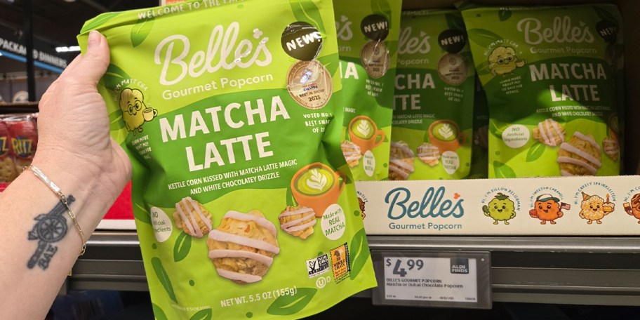 hand holding bag of belles matcha latte popcorn
