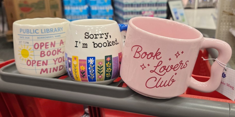 three book themed mugs on cart 