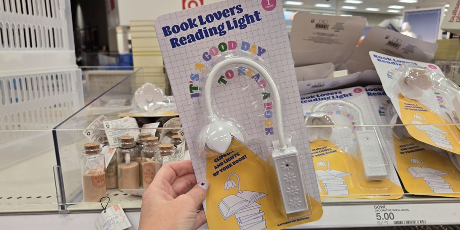 hand holding reading light 