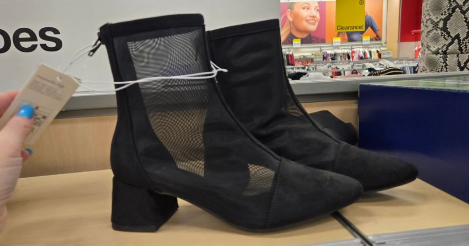 black boots on shelf in store