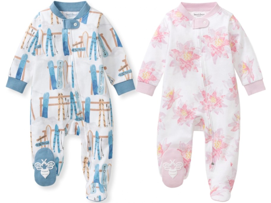 Two Burt's Bees Baby footed pajamas, one featuring a blue ski pattern and the other with a pink floral print, displayed against a white background.