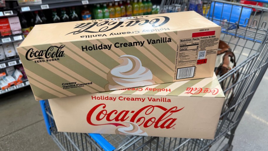 12 packs of coco cola holiday creamy vanilla in a shopping cart at walmart