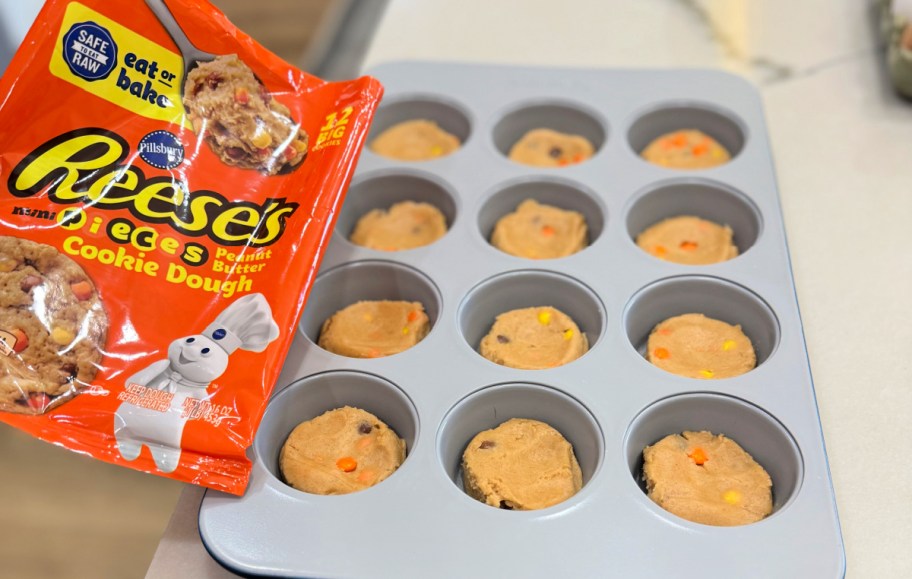 cookie dough on the bottom of a muffin pan