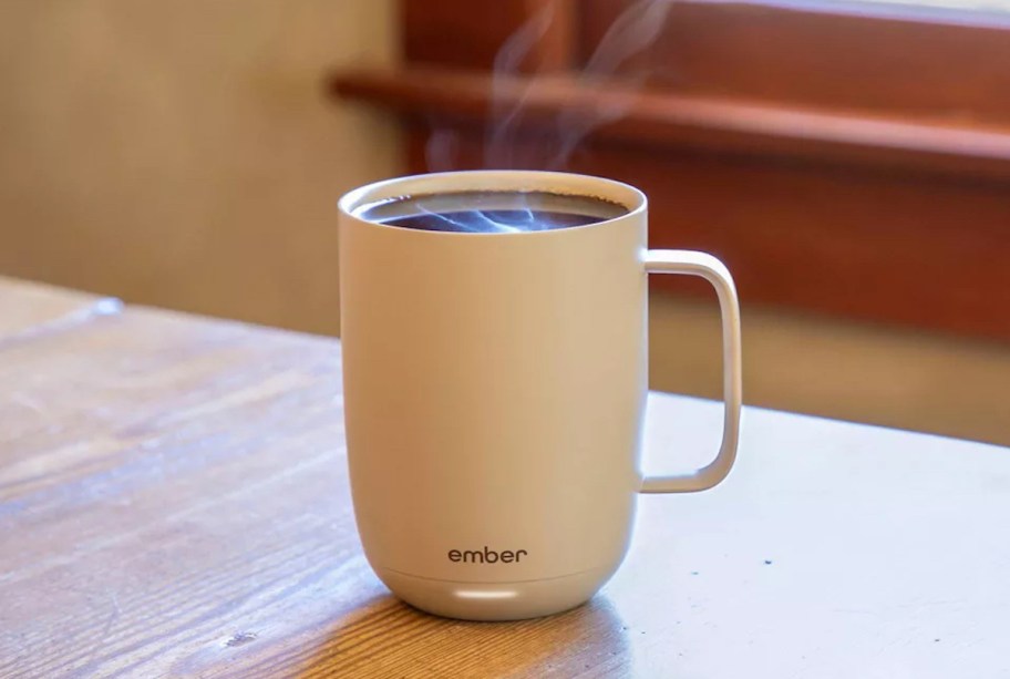 beige ember mug on table with steamy coffee