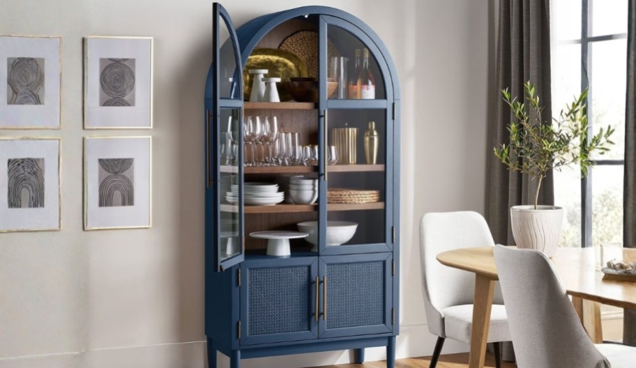 a dark blue rattan arch cabinet