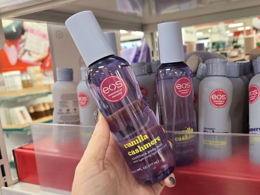 hand holding eos body mist in Vanilla Cashmere in store